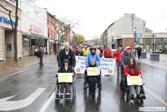 Leading a World Polio Day walk in Cobourg, Ontario, Canada, are Robert Scott (left), chair of Rotarys International PolioPlus Committee; Lynda Kay, president of the Rotary Club of Cobourg; and Rotarian Ken Rumball.